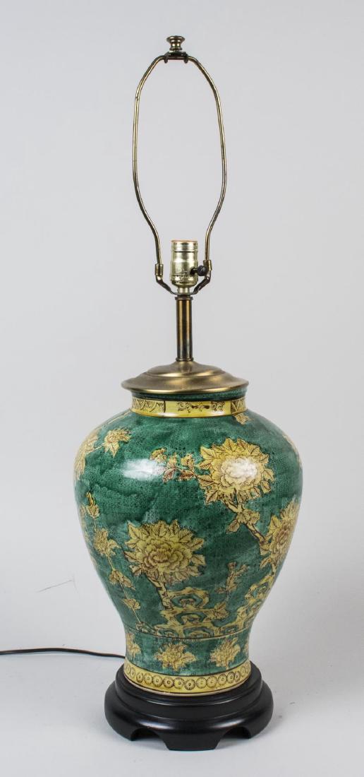 Ceramic Table Lamp: Two light lamp, green ovoid ceramic base. Base, height 24 inches. Notice to bidders: Condition reports and additional photographs are provided by request as a courtesy to our clients, as such any cond