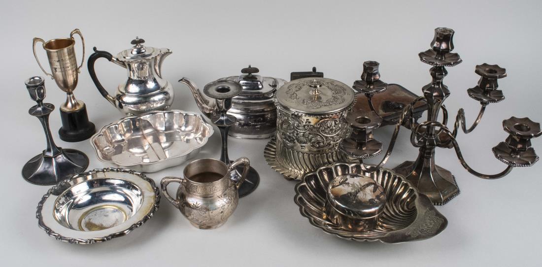 Group of Silver Plated Table Articles: Including a five light candelabra, biscuit barrel, shell form dish, coffee pot, etc. Notice to bidders: Condition reports and additional photographs are provided by request as a courtesy to our client
