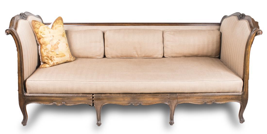 Louis XV Style Daybed: Rectangular upholstered back flanked by cartouche shaped upholstered ends, short cabriole legs. Height 38 1/2 inches, width 7 feet 4 inches, depth 37 inches. Notice to bidders: Condition reports and a