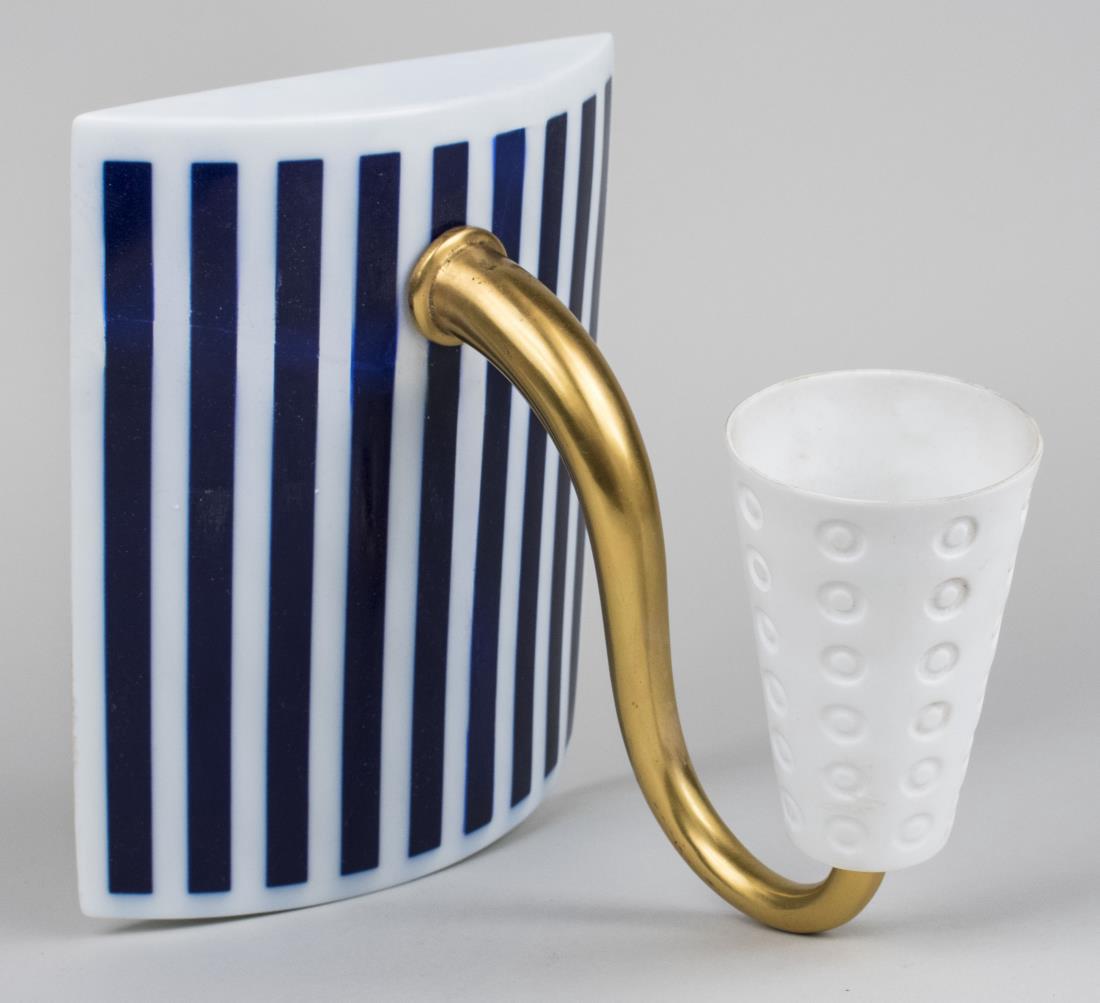 Bernardaud Porcelain Sconce: Single light sconce with porcelain shade on a gilt double scroll arm and a slightly bowed rectangular back plate with blue and white stripe decoration; together with an additional matching arm and sha