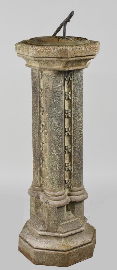 Sundial: Cast iron twig form sundial, on a cement base with octagonal top, on a quadruple columnar support above a conforming plinth base. Height 41 inches. Notice to bidders: Condition reports and additional