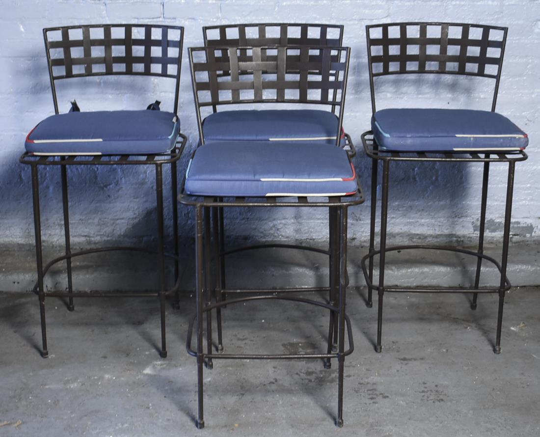 Janus et Cie Set of Four Garden Stools: From the Amalfi collection, each with woven metal slat back, blue cushion seat. Height 39 3/4 inches, width 20 inches, depth 22 inches. Notice to bidders: Condition reports and additional photographs 