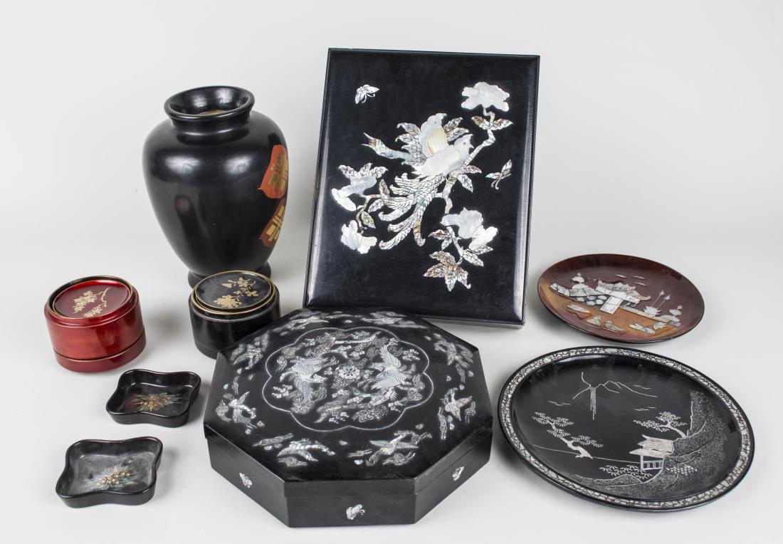 Group of Asian Lacquered Articles: Including two coaster sets, a rectangular box, two plates, a vase with metal liner, and an octagonal box with removable fitted interior, most with mother of pearl decoration. Vase height 9 inches. Not