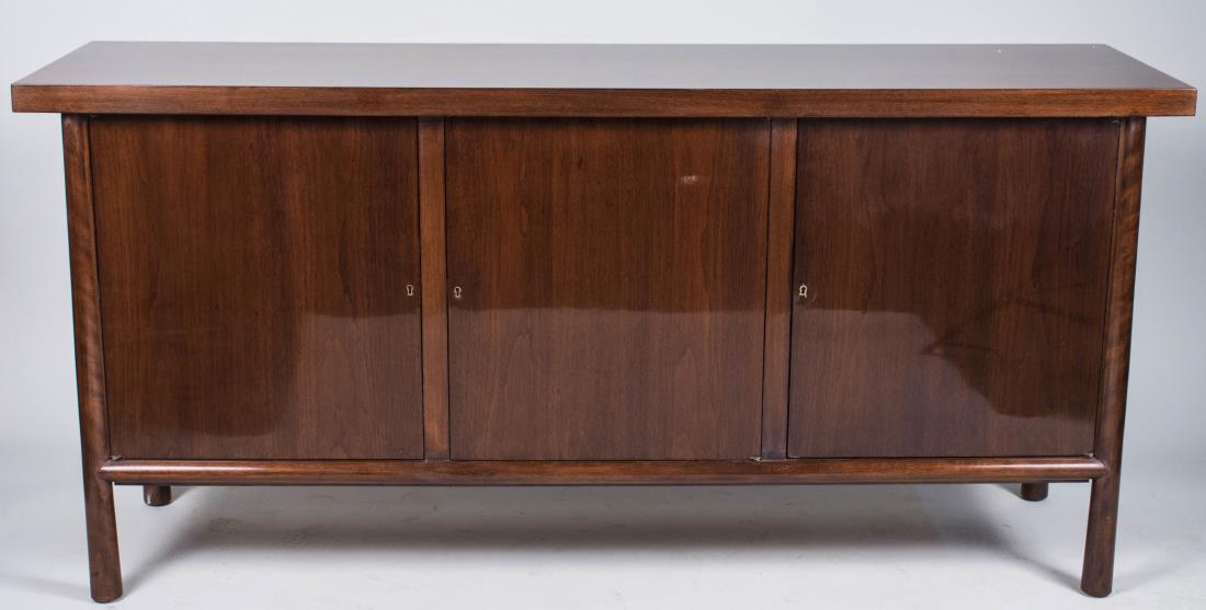 T.H Robsjohn Gibbings for Widdicomb Credenza: Rectangular top over three doors, columnar legs. Height 34 1/4 inches, width 6 feet, depth 20 inches. Notice to bidders: Condition reports and additional photographs are provided by request as a court