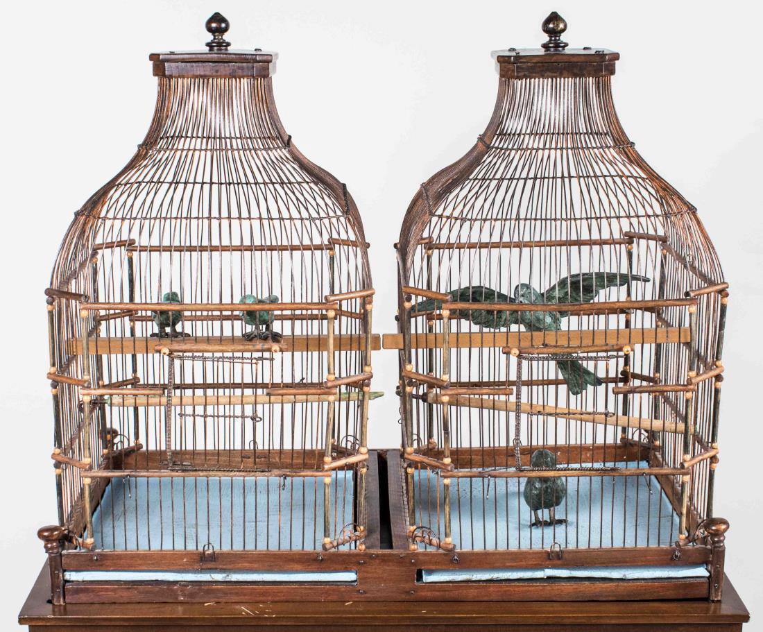Ilana Goor (American, b. 1936): Four Canaries in a wooden cage. Patinated bronze and wood, 20th century. Signed 'Goor' on birds. Bird height approx. 3.25 inches, cage height 21.5 inches, overall height with base 50 inches. Notice to