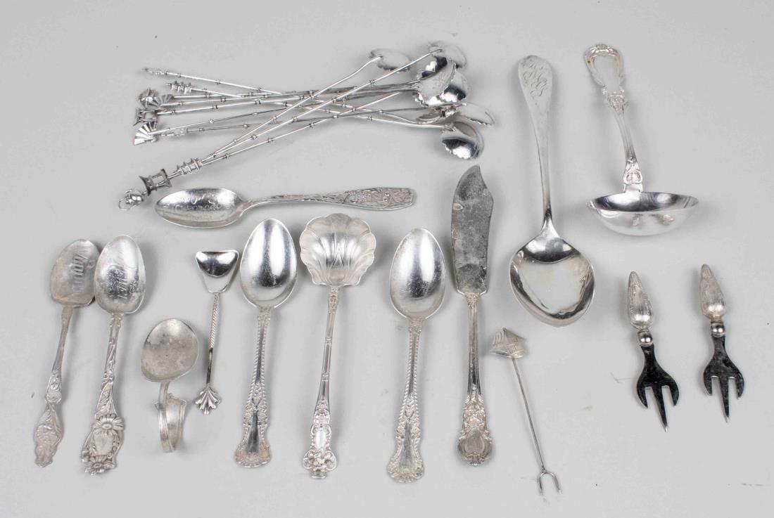 Group of Sterling Flatware: Various makers and patterns, including a set of ten iced tea spoons, Wallace serving spoon, an infant feeding spoon, souvenir spoons, a Peruvian silver ladle, etc. Total 350 grams. Notice to bidders: