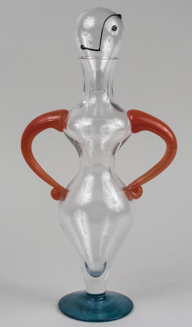 Kjell Engman for Kosta Boda Art Glass Decanter: Designed as an abstract figure, signed. Height 16 3/4 inches. Notice to bidders: Condition reports and additional photographs are provided by request as a courtesy to our clients, as such any conditio
