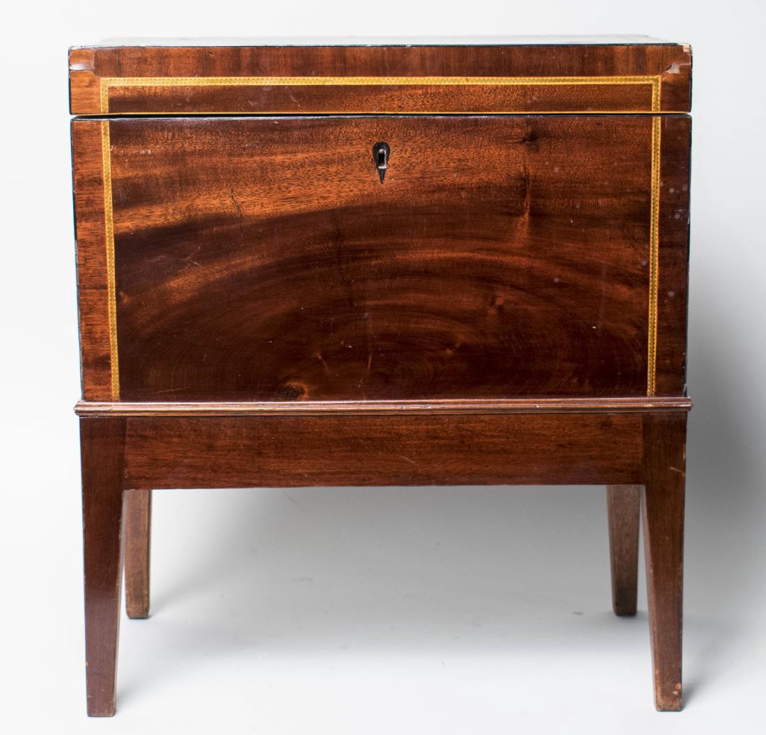 Victorian Mahogany Box on Stand: Line inlaid cellarette with fitted interior. Height 20 1/2 inches, width 18 inches, depth 10 inches. Notice to bidders: Condition reports and additional photographs are provided by request as a courte