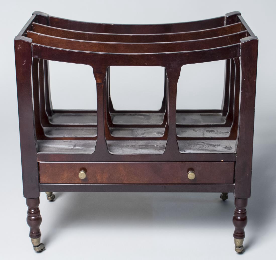 Georgian Style Mahogany Canterbury: Three open slots above a drawer, turned legs ending in brass casters. Height 20 inches, width 20 inches, depth 12 1/2 inches. Notice to bidders: Condition reports and additional photographs are provid
