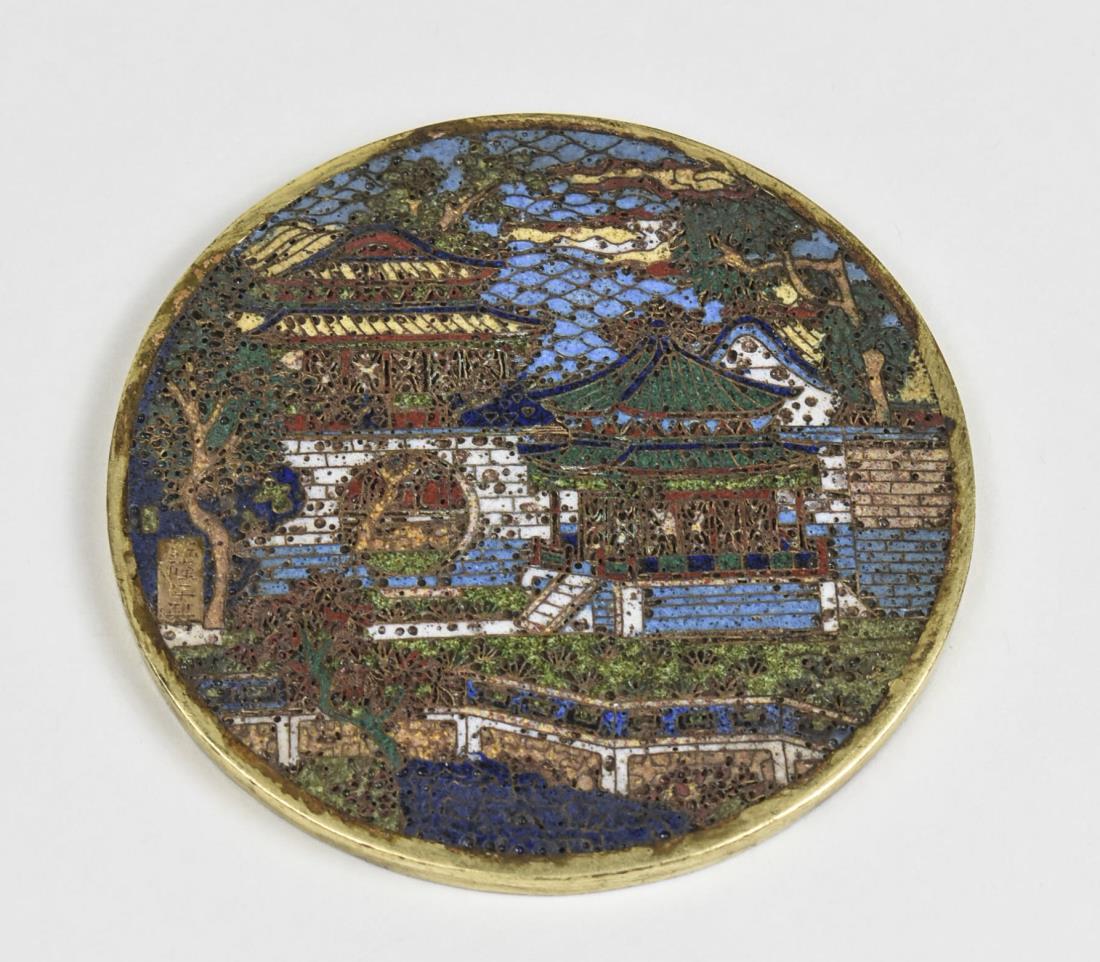 Chinese Cloisonne Hand Mirror: Circular mirror with polychrome pagoda landscape decoration. Diameter 3 3/4 inches. Notice to bidders: Condition reports and additional photographs are provided by request as a courtesy to our clients