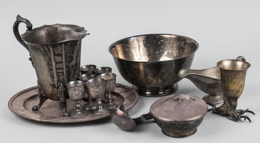 Group of Silver Plated Table Articles: Including a pitcher, a circular tray, cups, a revere bowl, a sauceboat etc. Various sizes. Notice to bidders: Condition reports and additional photographs are provided by request as a courtesy to our 