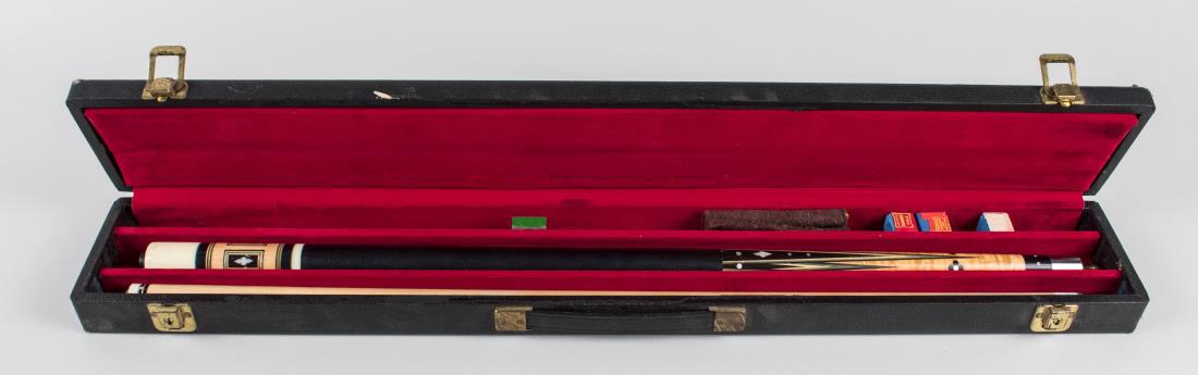 Pool Cue: Two piece cue with leather wrapped grip and hard travel / storage case. Notice to bidders: Condition reports and additional photographs are provided by request as a courtesy to our clients, as such an