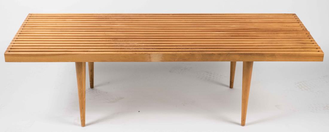 George Nelson Slat Coffee Table: Rectangular slat top on round tapered legs. Height 14 inches, width 48 inches, depth 18 inches. Notice to bidders: Condition reports and additional photographs are provided by request as a courtesy to