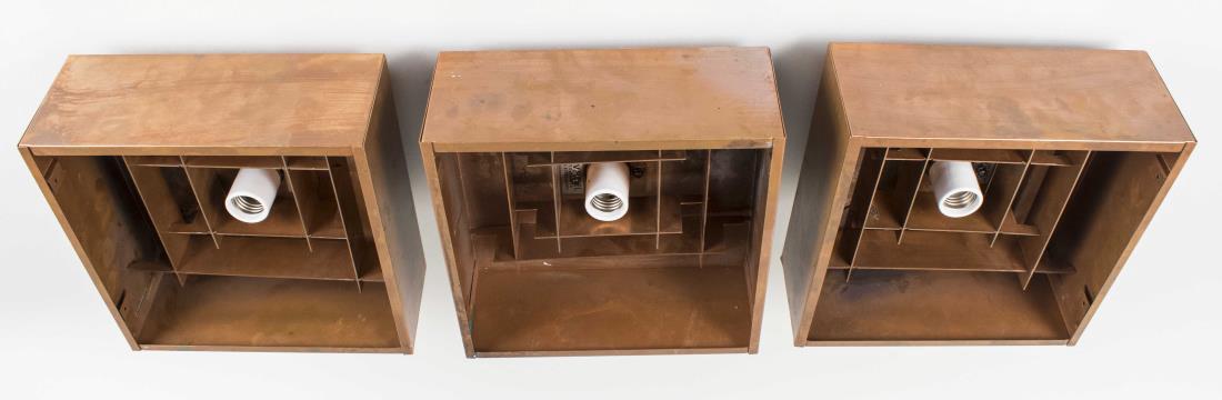 Set of Three Danish Copper Ceiling Pendants: Mid century design, square single light fixtures. Height 5 1/4 inches, 10 inches square. Provenance: Estate of Sandy Gallin Notice to bidders: Condition reports and additional photographs are provided