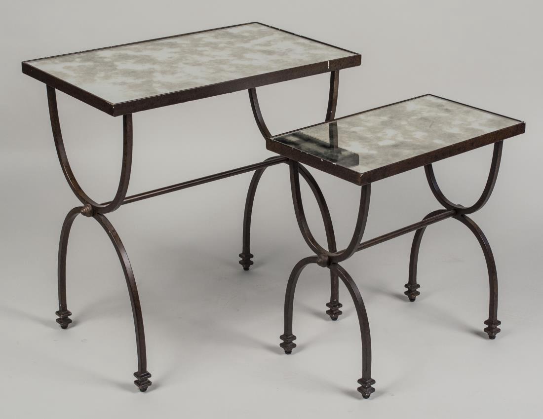 Nest of Two Mirrored Top Tables: Each with rectangular top on a black metal double curule base. Height 25 inches, width 24 inches, depth 14 inches. Notice to bidders: Condition reports and additional photographs are provided by reque