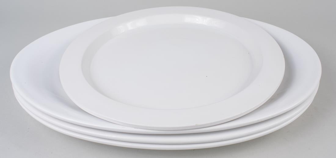 Four Calvin Klein White Ceramic Platters: Three oval platters by William Sonoma, and one circular by Calvin Klein for Swid Powell, Georgica pattern. Oval platter, 16 x 23 inches. Provenance: Estate of Sandy Gallin Notice to bidders: Condition