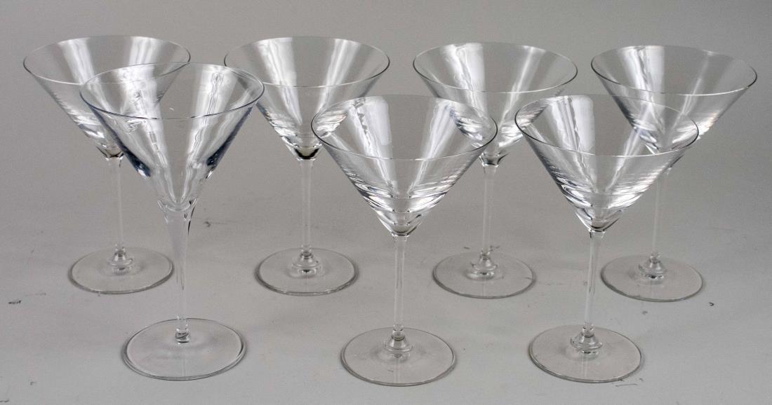 Set of Six Steuben Martini Glasses: Together with one Luigi Bormioli martini glass. Set, height 6 inches. Provenance: Estate of Sandy Gallin Notice to bidders: Condition reports and additional photographs are provided by request as a co