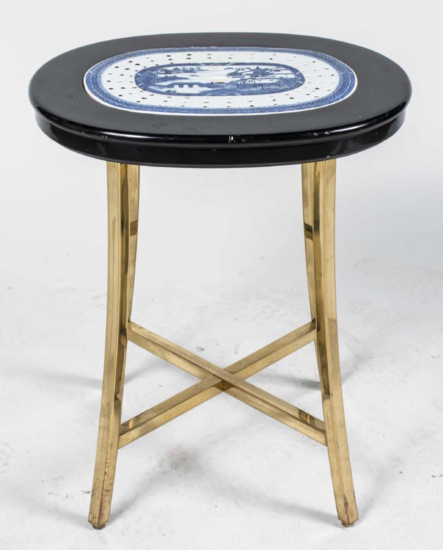 Oval Side Table: Oval top inset with an English blue and white ironstone drain pan, brass legs. Height 21 inches, width 17 3/4 inches, depth 14 1/2 inches. Notice to bidders: Condition reports and additional photograp