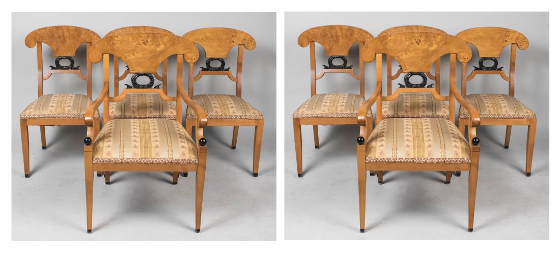 Set of Eight Biedermeier Chairs: Parcel ebonized open backs, upholstered seats, two armchairs and six side chars. Height 37 inches, width 24 inches, depth 21 inches. Notice to bidders: Condition reports and additional photographs are