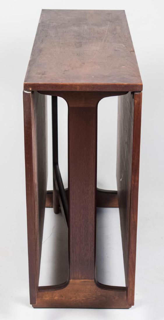 Drop Leaf Dining Table: Rectangular top with two rectangular drop leaves, swing gate legs. Closed, height 29 inches, width 38 inches, depth 12 inches. Notice to bidders: Condition reports and additional photographs are provi