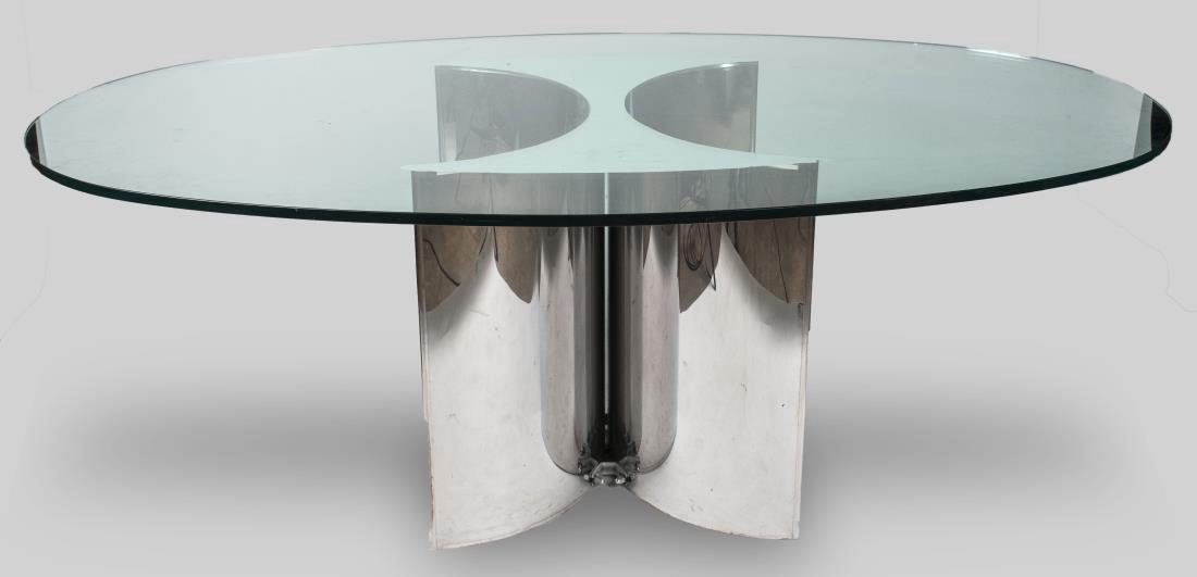 Glass Top Dining Room Table: Oval top on metal base. Height 27 1/2 inches, width 76 inches, depth 44 inches. Notice to bidders: Condition reports and additional photographs are provided by request as a courtesy to our clients, as