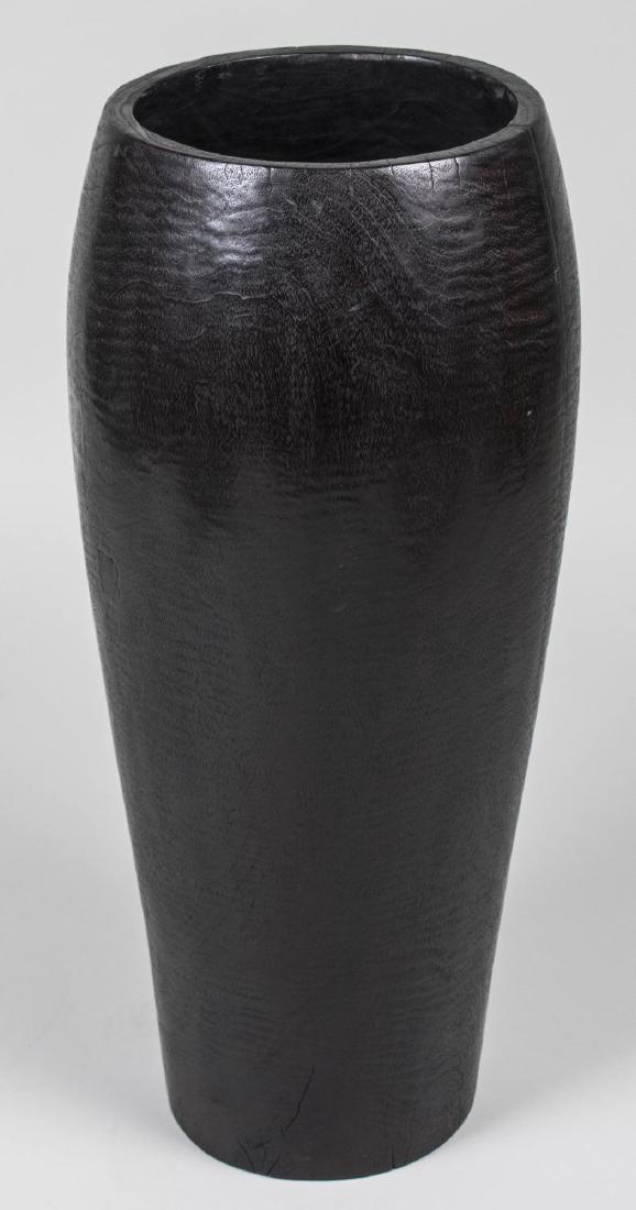 Ebonized Wood Vase: Tapered cylindrical design. Height 31 inches. Provenance: Estate of Sandy Gallin Notice to bidders: Condition reports and additional photographs are provided by request as a courtesy to our clients, a