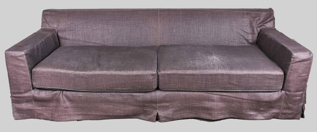 Christian Liaigre at Holly Hunt Sofa: Purple fabric upholstery, two cushion seat. Height 30 inches, width 97 inches, depth 44 inches. Notice to bidders: Condition reports and additional photographs are provided by request as a courtesy to