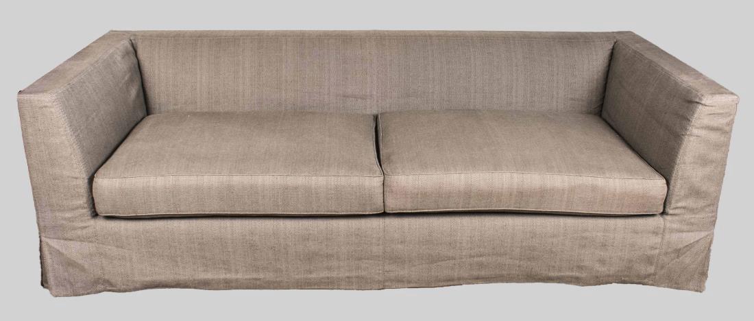 Christian Liaigre at Holly Hunt Sofa: Beige fabric upholstery, two cushion seat. Height 29 inches, width 93 inches, depth 38 inches. Notice to bidders: Condition reports and additional photographs are provided by request as a courtesy to 