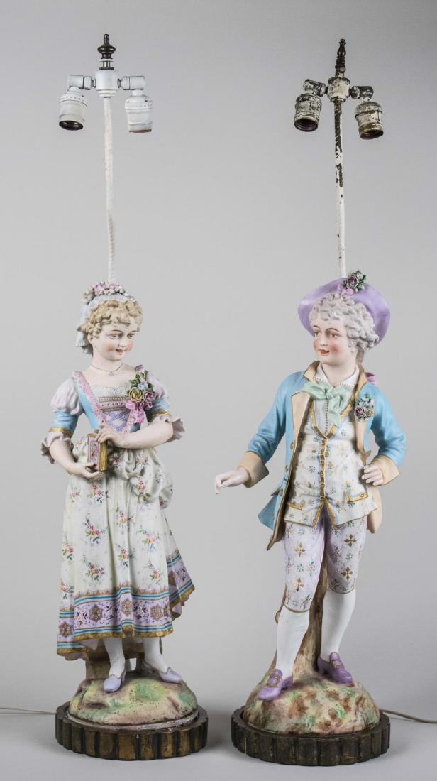 Pair of FIgural Lamps: Two light lamps, with a boy and girl figure. Figure, height 22 inches, overall, height 35 1/2 inches. Notice to bidders: Condition reports and additional photographs are provided by request as a court