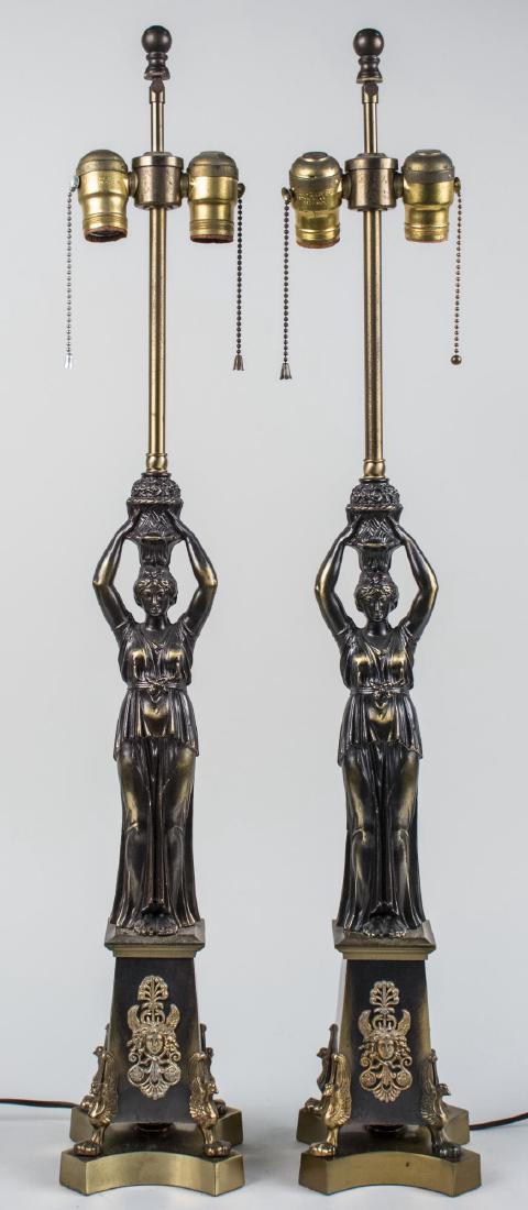 Pair of Figural Lamps: Neoclassical style two light lamps with female figures. Height 33 inches. Notice to bidders: Condition reports and additional photographs are provided by request as a courtesy to our clients, as such 