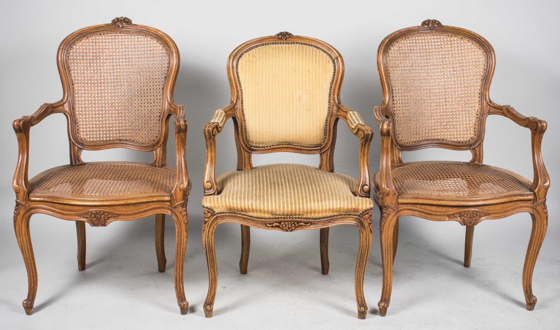 Three Louis XV Style Fauteuils: Two caned chairs and an upholstered chair. Caned chair height 39 inches, width 21 inches, depth 24 inches. Notice to bidders: Condition reports and additional photographs are provided by request as a