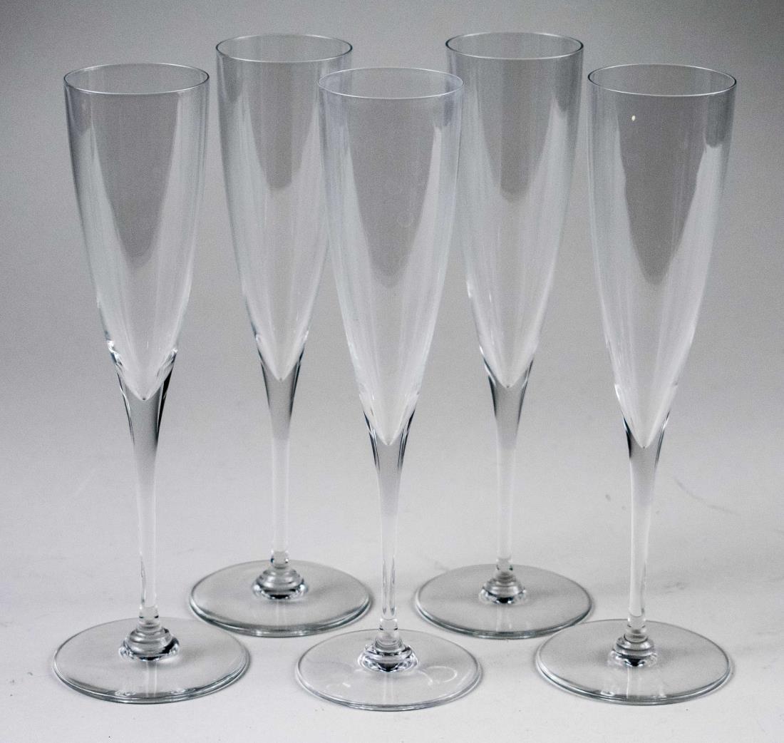 Set of Five Baccarat Crystal Champagne Flutes: Dom Perignon pattern. Height 9 1/4 inches. Notice to bidders: Condition reports and additional photographs are provided by request as a courtesy to our clients, as such any condition report is only an