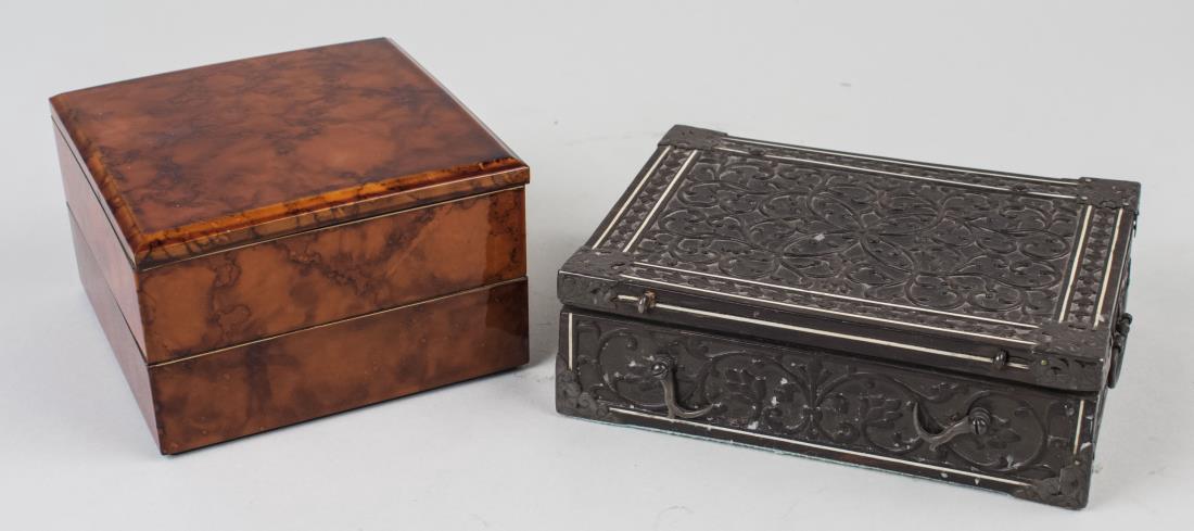 Two Decorative Boxes: One, a Renaissance Revival style Florentine carved wood box; the other a red lacquer box. Wood box, height 2 inches, width 7 inches, depth 5 inches. Provenance: Estate of Sandy Gallin Notice to bidder