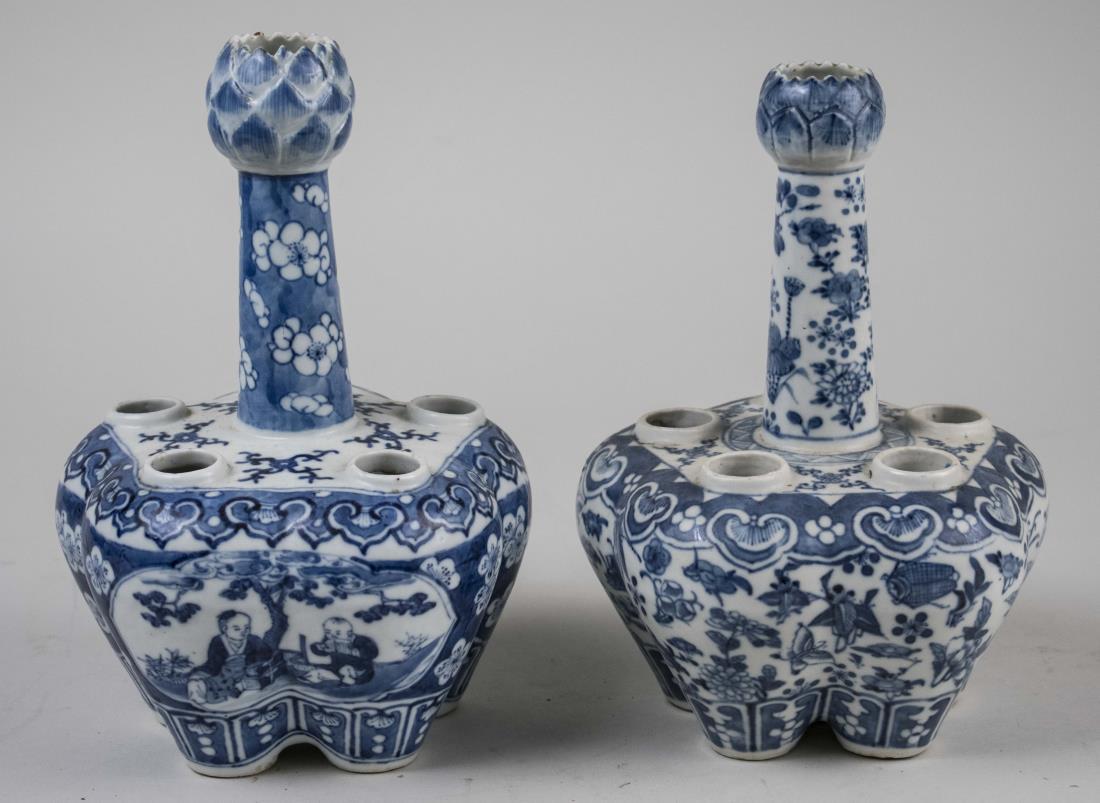 Two Chinese Blue and White Porcelain Bulb Vases: 19th century, near pair with five openings and central lotus flower bulb topped shaft, decorated with flowers and vines. Height 10 inches. Notice to bidders: Condition reports and additional photograp