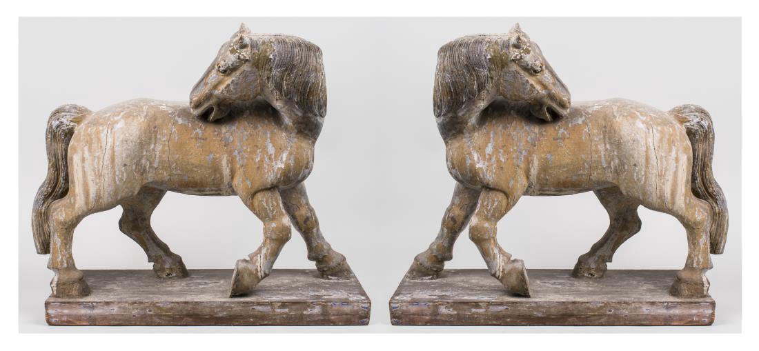 Pair of Tang Style Horses: Each modeled standing while looking back over a shoulder, with remnants of original paint. Height 23 inches. Notice to bidders: Condition reports and additional photographs are provided by request as 