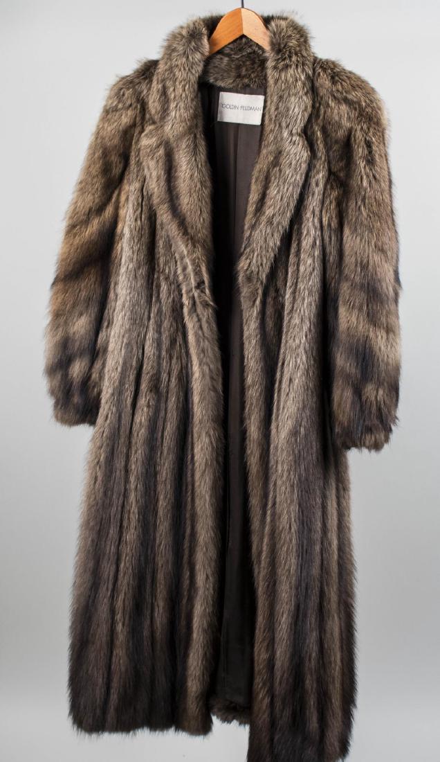 Goldin Feldman Fur Coat: Full length natural Canadian Lynx fur coat. Size medium-large. Notice to bidders: Condition reports and additional photographs are provided by request as a courtesy to our clients, as such any conditi