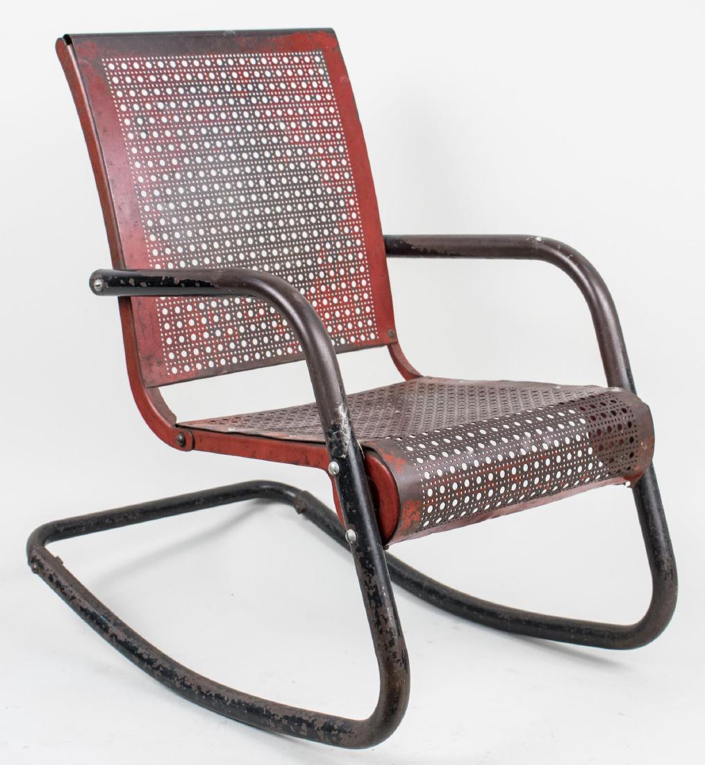 Painted Metal Child's Rocking Chair: Openwork metal back and seat on a tubular frame. Height 25 1/4 inches, width Notice to bidders: Condition reports and additional photographs are provided by request as a courtesy to our clients, as su