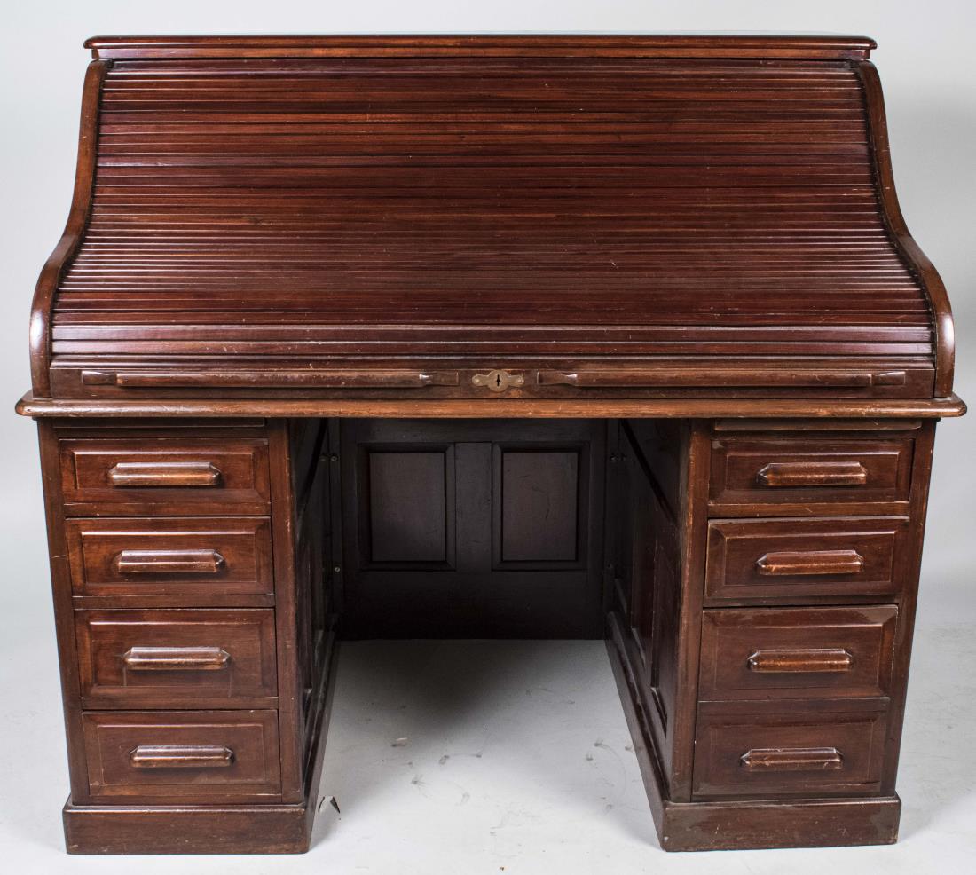Walnut Roll Top Desk: Tambour front, opening to a fitted interior, over two pedestals of four drawers. Height 49 inches, width 54 inches, depth 34 inches. Notice to bidders: Condition reports and additional photographs are