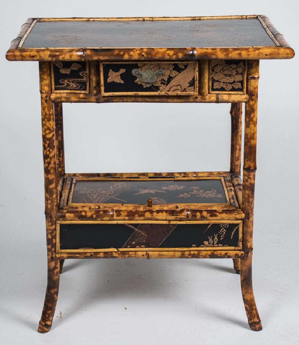 Regency Bamboo Side Table: Rectangular top decorated with flowers and birds, over a drawer, on bamboo legs joined by a lower shelf. Height 30 inches, width 18 inches, depth 26 inches. Notice to bidders: Condition reports and ad