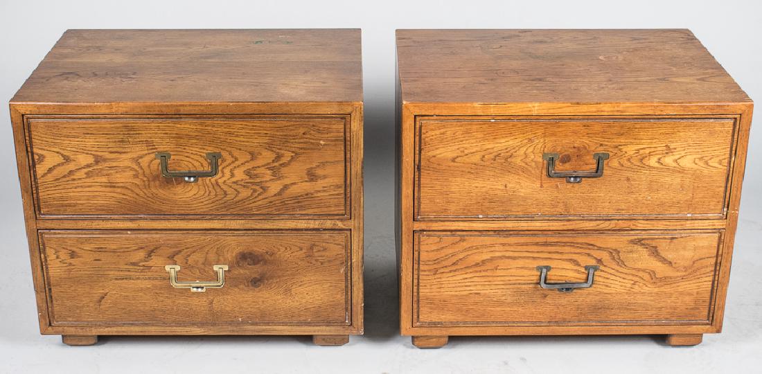 Pair of Henredon Campaign Style Nightstands: Each with rectangular top over two drawers. Height 21 1/2 inches, width 18 inches, depth 25 inches. Notice to bidders: Condition reports and additional photographs are provided by request as a courtes