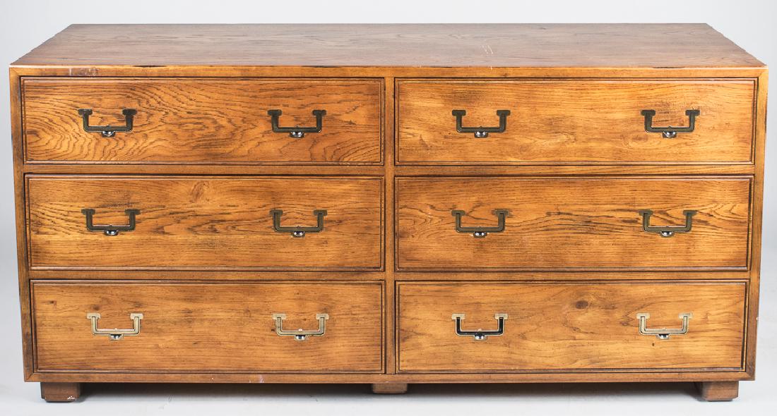 Henredon Campaign Style Dresser: Rectangular top over two banks of three drawers. Height 30 inches, width 62 inches, depth 19 inches. Notice to bidders: Condition reports and additional photographs are provided by request as a courte