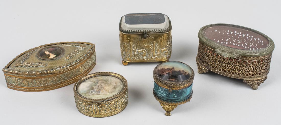 Group of French Trinket Boxes: All gilt metal boxes with glass liners, various styles and sizes. Notice to bidders: Condition reports and additional photographs are provided by request as a courtesy to our clients, as such any cond