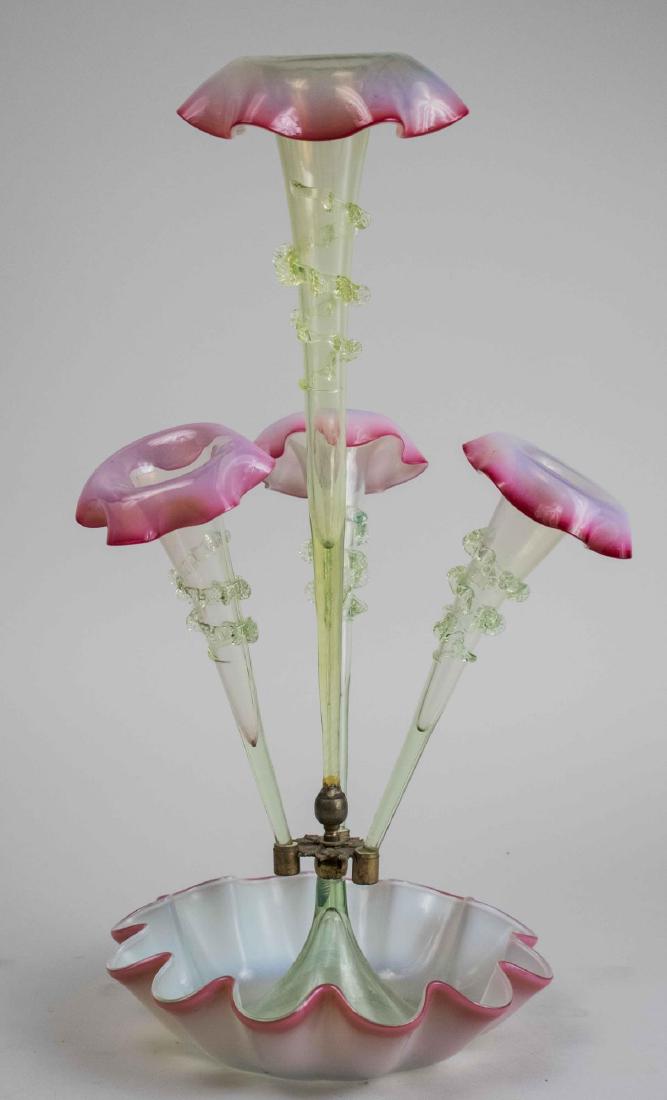 American Glass Epergne: 19th century, pale green fading to rose at the edges, three arms centering a vase. Height 22 inches. Notice to bidders: Condition reports and additional photographs are provided by request as a courte