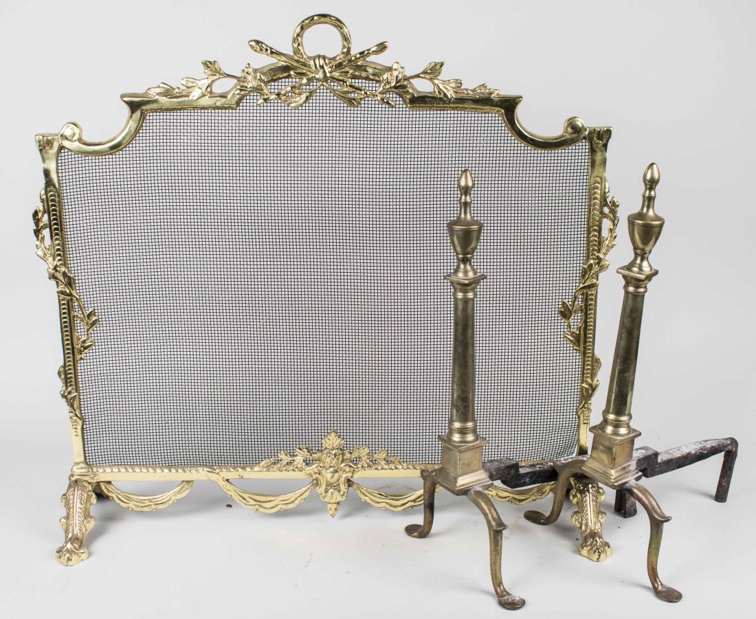 Brass Fire Screen: Neoclassical style with ribbon and wreath decoration, together with a pair of urn topped columnar andirons. Notice to bidders: Condition reports and additional photographs are provided by request as a