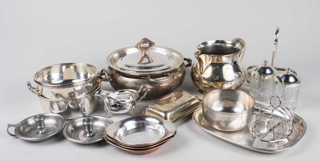 Group of Silver Plated Table Articles: Including a pitcher, covered entree dish, individual serving dishes, small tray, and a pair of pewter chambersticks. Pitcher, height 5 1/2 inches. Notice to bidders: Condition reports and additional p