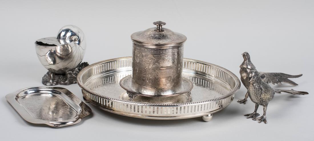 Group of Silver Plated Table Articles: Including a circular serving tray, a pair of table pheasants, a nautilus spoon caddy, a biscuit barrel and a small relish tray. Circular tray, diameter 15 inches. Notice to bidders: Condition reports 