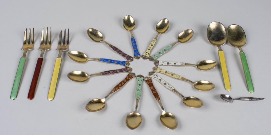Group of Silver and Enamel Flatware: Various assorted makers and patterns, forks and spoons. Notice to bidders: Condition reports and additional photographs are provided by request as a courtesy to our clients, as such any condition repo