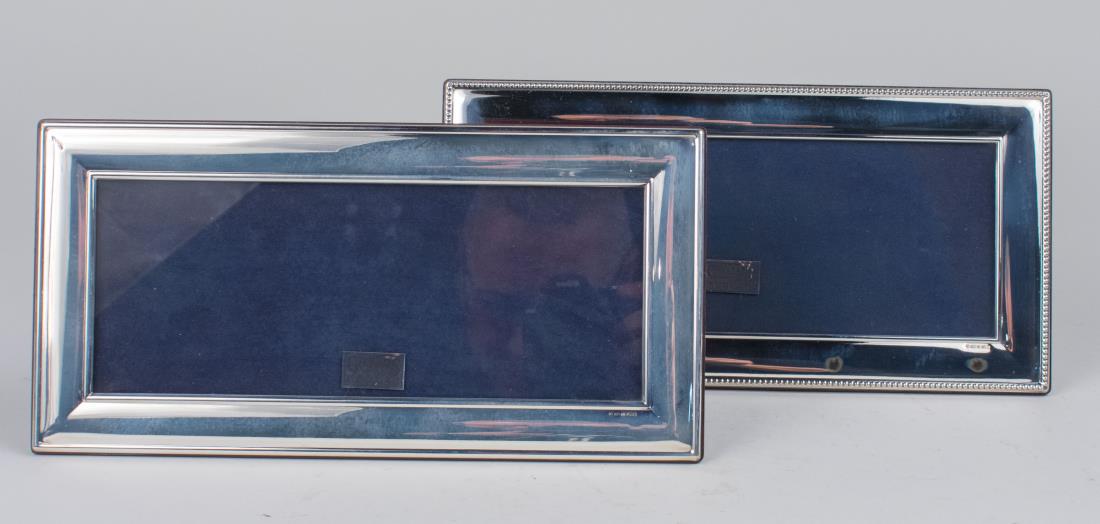Pair of English Silver Picture Frames: Carr's Collection, new in box, Holds, 10 x 4 picture. Notice to bidders: Condition reports and additional photographs are provided by request as a courtesy to our clients, as such any condition report