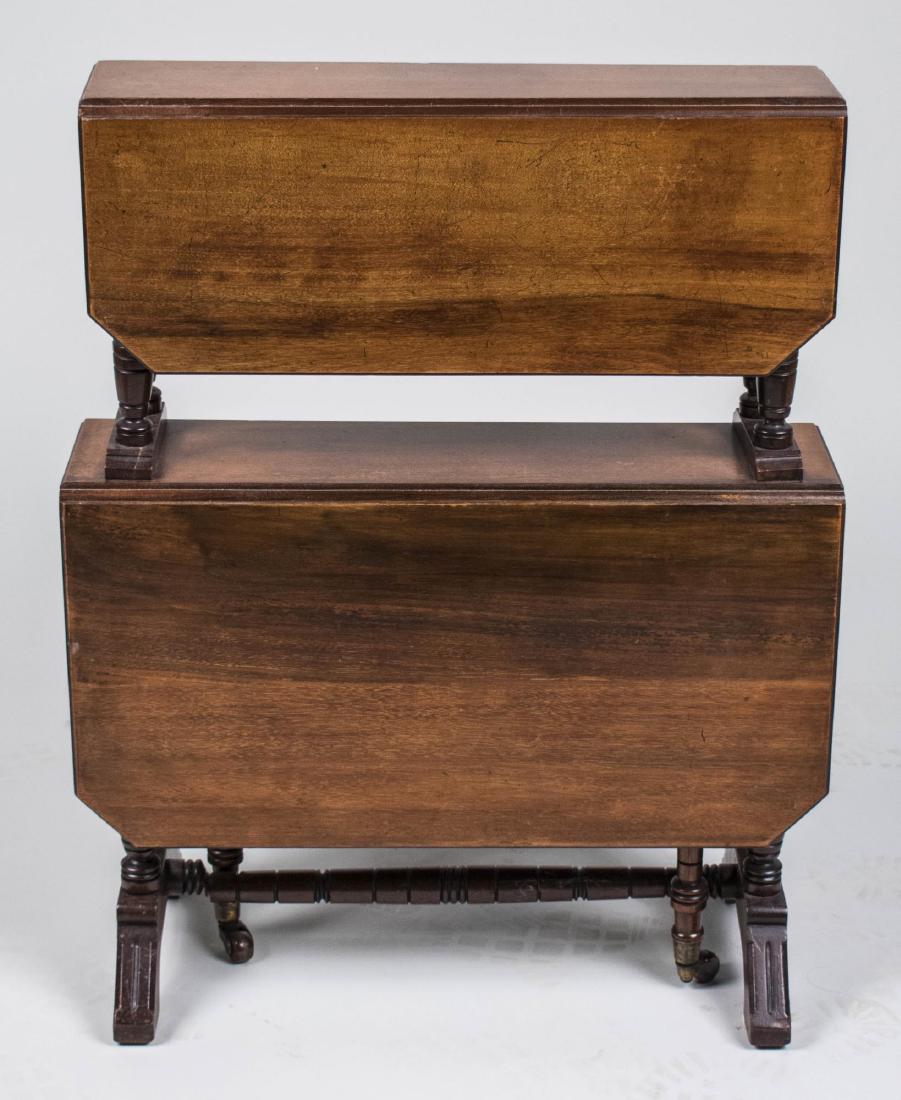 Two Tier Fruitwood Drop Leaf Table: Upper shelf on turned supports, the lower shelf supported on turmed gate legs. Height 30 inches, width 22 inches, depth 6 inches. Notice to bidders: Condition reports and additional photographs are pr