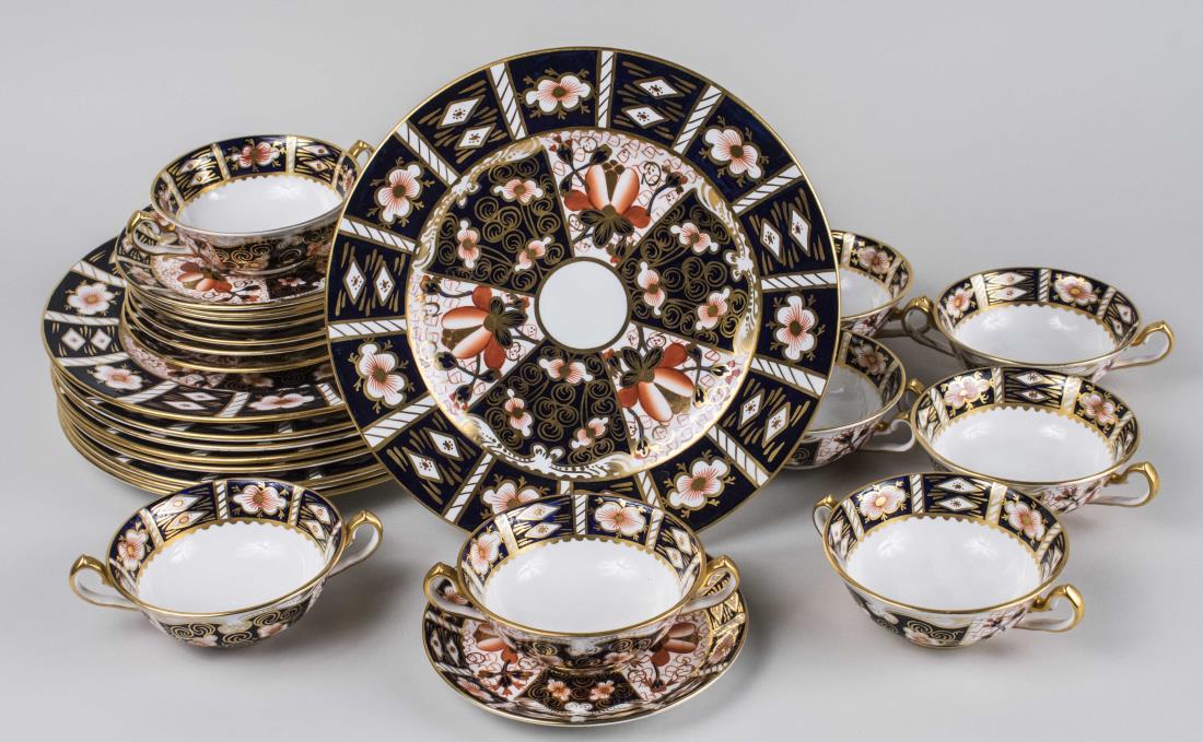 Royal Crown Derby Porcelain Partial Dinner Service: Approximately twenty five pieces, Traditional Imari (2451) pattern, comprising nine dinner plates, eight cream soup bowls, and eight underplates. Dinner plate diameter 10 5/8 inches. Notice to bidders